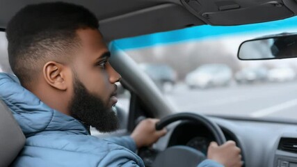 A man is focused on driving in a car, navigating the road with determination. He enjoys the journey, feeling a mix of excitement and relaxation while traveling through a beautiful landscape.