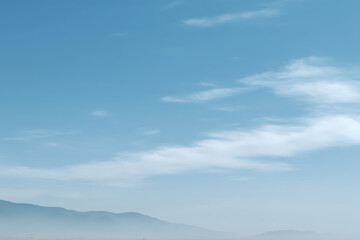 photorealistic ultraminimalist depiction of expansive sky featuring soft gradients and subtle cloud formations