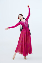 Beautiful dancers performing traditional Uyghur dance from Xinjiang, China