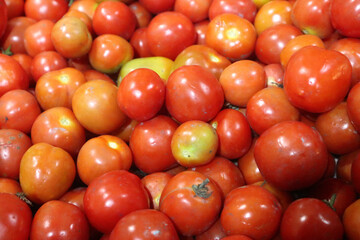 close up of fresh red tomatoes. vitamin a in red tomatoes