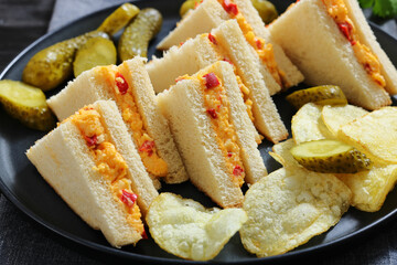 pimento cheese sandwiches with pickles and chips