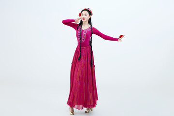 Beautiful dancers performing traditional Uyghur dance from Xinjiang, China