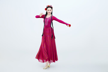 Beautiful dancers performing traditional Uyghur dance from Xinjiang, China