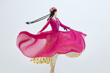 Beautiful dancers performing traditional Uyghur dance from Xinjiang, China
