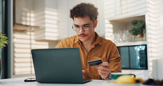 Man, credit card or typing on laptop in home for online shopping, cart checkout or digital transaction. Fintech, person or internet portal for bills payment, banking or debit details for subscription