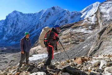 Two Sherpa on their ascend to Tashi Labsta pass in the Himalaya, Nepal