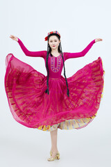 Beautiful dancers performing traditional Uyghur dance from Xinjiang, China