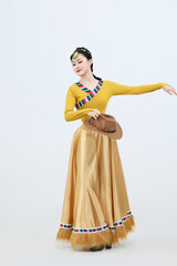 Beautiful dancers performing traditional Tibetan Guozhuang dance in Tibet, China