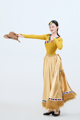 Beautiful dancers performing traditional Tibetan Guozhuang dance in Tibet, China