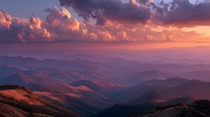 Fototapeta premium Panoramic scenic sunset landscape with golden sunlight beaming through clouds, casting soft orange and purple gradient hues across the sky in warm atmospheric glow at dusk