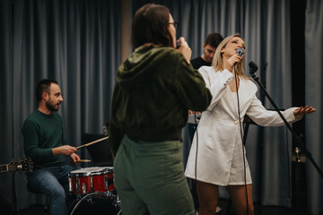 A group of musicians in a studio engaging in a professional practice session, showcasing collaboration.