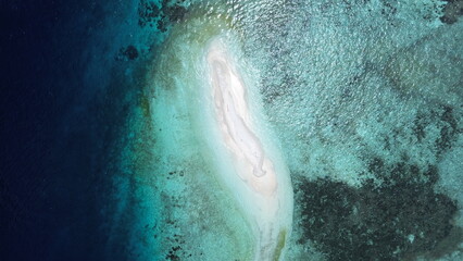 Aerial Drone View of Sandbank next to Arborek Island, Turquoise Waters and Coral Reefs – Raja Ampat, Indonesia...