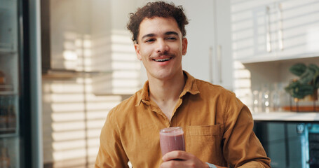 Man, thinking and smile in home with smoothie, protein shake and beverage for gut health....