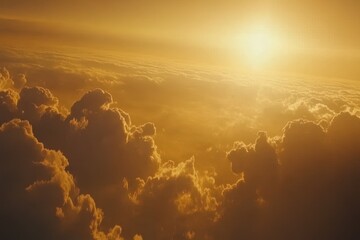 Golden sunset view from above clouds