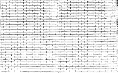 A black and white grungy brick wall. Dilapidated brick pattern in black and white. 
