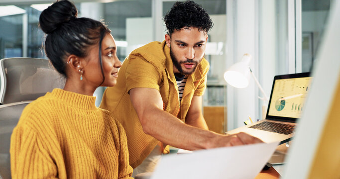 Creative, graphs and business people in office, computer and teamwork for sales agency. Employees, man and woman in workplace, documents and charts for social media subscription, talk and cooperation - Powered by Adobe