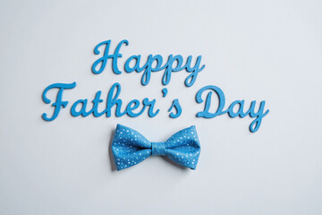 blue bow tie with the words happy fathers day on it