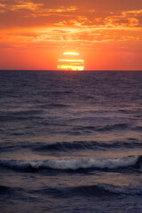 Sunset Paints the Ocean Horizon in Golden Hues Over Tranquil Waves
