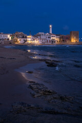 Captivating Blue Hour Glow Over Punta Secca in Sicily's Enchanting Coastal Town, Italy