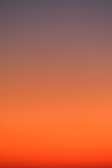 Naklejka premium Gradient sky with warm orange and purple tones. Abstract background for design and print