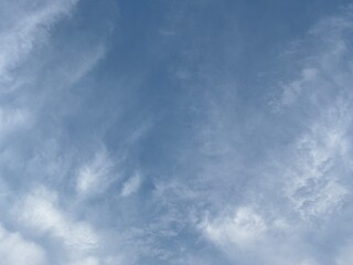 Obraz premium clean bright blue sky background with beautiful clean white clouds, creative natural background