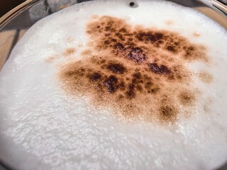 Fototapeta premium Frothy Cappuccino with Sprinkled Cocoa Powder