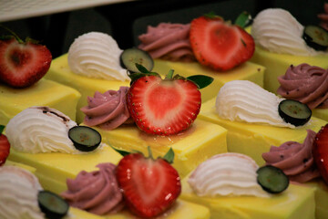 Yellow dessert with strawberries