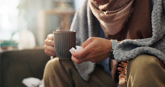 Hands, tissue and person with tea in living room, sick or health issue with influenza, hayfever or sinusitis. Hot beverage, electrolyte liquid or medicine for illness, wellness and flu at house
