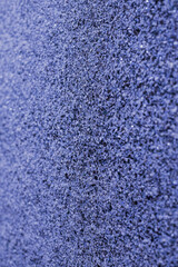 Stone color sparkling texture of the wall on blue background