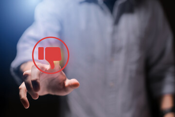 Man using smartphone or tablet, pointing finger at dislike button, thumbs down button, Interface,Thumbs up icon, display screen, touch screen, Virtual Image Technology