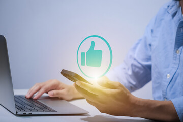 Man using smartphone or tablet, pointing finger at like button, thumbs down button, Interface,Thumbs up icon, display screen, touch screen, Virtual Image Technology