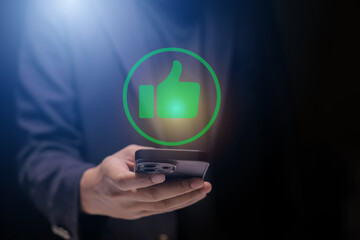 Man using smartphone or tablet, pointing finger at like button, thumbs down button, Interface,Thumbs up icon, display screen, touch screen, Virtual Image Technology