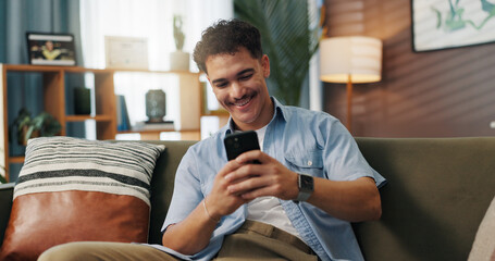 Relax, smile and man on smartphone on sofa for communication, chat or reading message. Home, online...