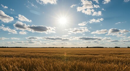 Obraz premium A serene blue sky with a dazzling sun and picturesque, scattered white clouds