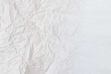 Crumpled white paper background.