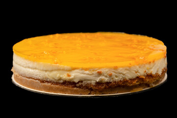 Orange cheesecake isolated on a white background.