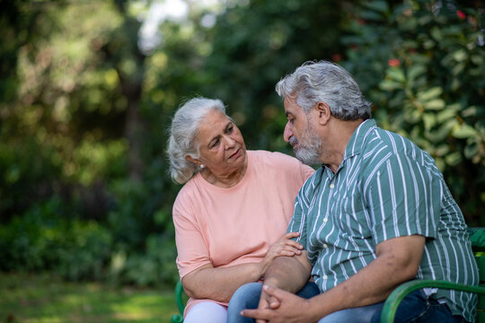 Indian senior couple having in Disrespect, Disowned, Discomfort, Sad depression and bad news. Communication, anxiety and mental health with elderly man and woman for retirement