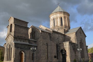 Obraz premium Church on the seashore. Monastery in nature. Armenian church on the river bank. Beautiful architecture of churches.