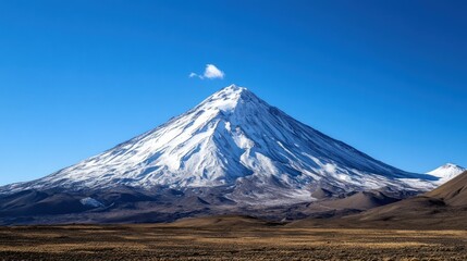 Fototapeta premium Majestic snow-capped mountain under a clear blue sky, showcasing the natural beauty of nature