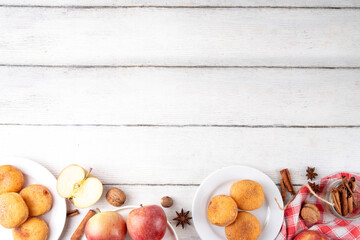 Tasty homemade apple pie autumn tasty donuts with cinnamon sugar glazing and apple jam filling,...