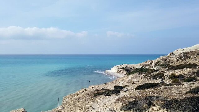 White rocks line the coast of Pissouri, Limassol, where the deep blue sea meets bright skies. This stunning coastal view captures the raw beauty of Cyprus&rsquo;s Mediterranean shoreline.