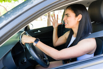 Frustrated driver expressing road rage in traffic
