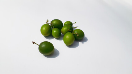 Bidara (Ziziphus mauritiana) fruit on a white background. Also known as widara, Indian jujube, Indian plum, Chinese date, Chinese apple, ber and dunks. Nature concept.