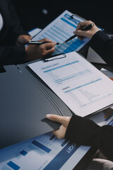 Teamwork with business people analysis cost graph on desk at meeting room. double exposure successful teamwork,business planning concept.