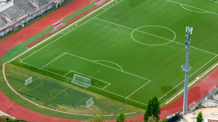 Aerial closeup of the municipal stadium of Gaeta, in the province of Latina, Lazio, Italy. It is a grass soccer field. © Stefano Tammaro