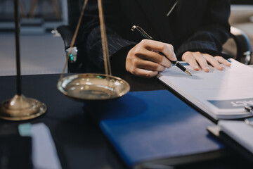 Judge gavel with Justice lawyers, Business woam in suit or lawyer working on a documents. Legal law, advice and justice concept..