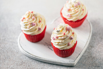Red velvet cupcakes with whipped cream for Holidays