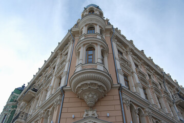 Corner building with balconies. A low angle view of the corner of a beautiful building.