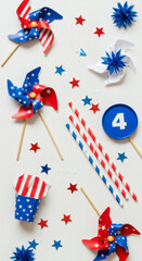 Fototapeta premium Flat Lay of Red White and Blue Party Decor with Pinwheels and Stripes for July 4th