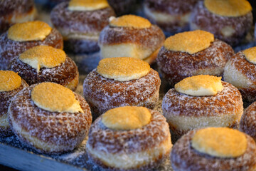Closeup of donuts on a bakery stall at a food market
